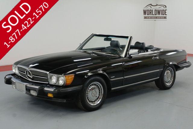 1986 MERCEDES BENZ 560 SERIES TRIPLE BLACK! IMMACULATE. LOW MILES. COLD A/C.